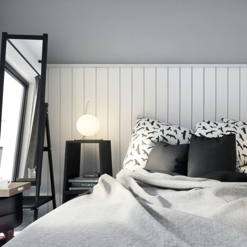 bedroom area with white planks and grey wall