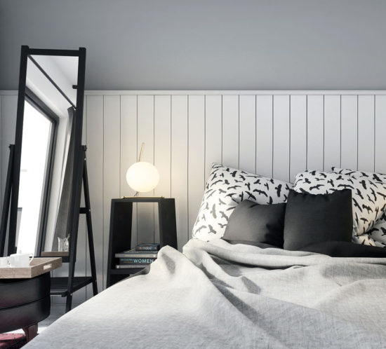 bedroom area with white planks and grey wall