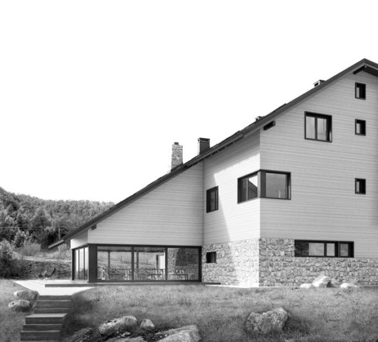 Side view of modern mountain social center with wooden facade