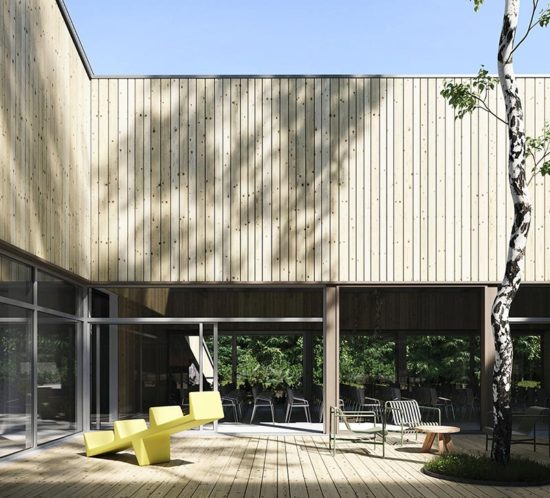 hotel atrium with wood facade and outdoor furniture