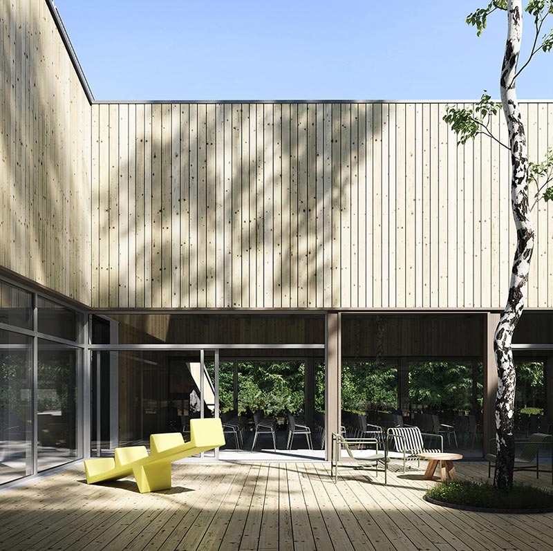 hotel atrium with wood facade and outdoor furniture
