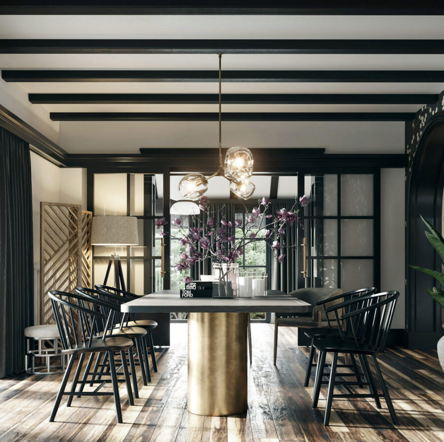 countryside house interior with massive brass dining table and black wooden chairs