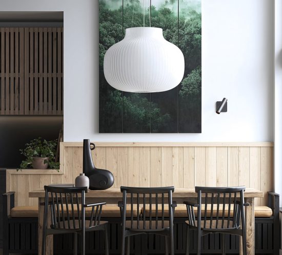 Warm, cozy dining area with wooden furniture and a large chandelier