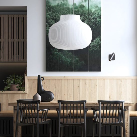 Warm, cozy dining area with wooden furniture and a large chandelier